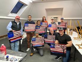 Vista Fire Department members showing off their paintings after their class at the "Ridgefield Guild of Artists"