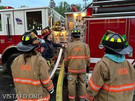 Station Manager Brian Porco going over the Engine 143 pump panel