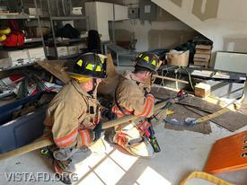 Firefighter Phil Katz and Firefighter Dan Hochman practice advancing a 1-3/4" hoseline