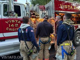 Captain Marc Baiocco reviewing the Engine 142 pump panel during the “Hydrant Service” drill
