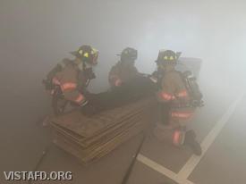 Vista Firefighters locate a "victim" during a Search, Rescue & V.E.I.S. training scenario