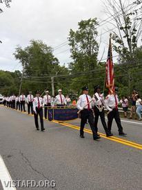 Vista Fire Department personnel and the Department Color Guard marching in the South Salem Parade