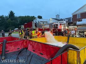 Vista Tanker 4 dumping water into the portable pond during the "South Salem Tanker Shuttle" drill