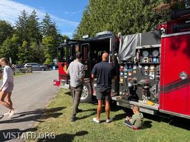 Firefighter Jose Rosa providing a tour of Engine 141 during the Lewisboro Library Fair