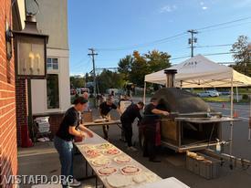 Vista Fire Department members preparing pizzas during "Pizza Night"