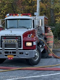 Probationary Firefighter/EMT Candidate Jared Richardson operating the Engine 142 pump panel during driver training
